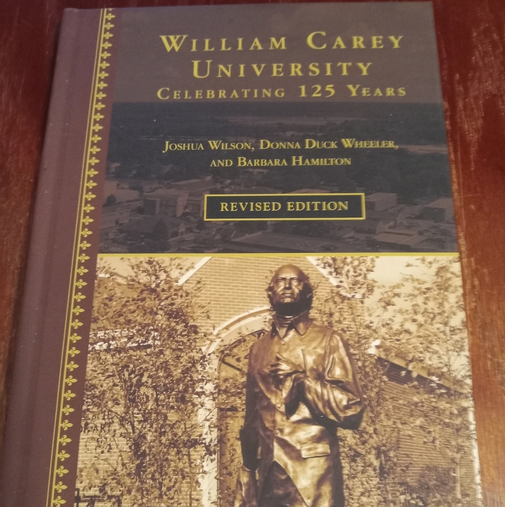 William Carey University History Book - Brown and Gold